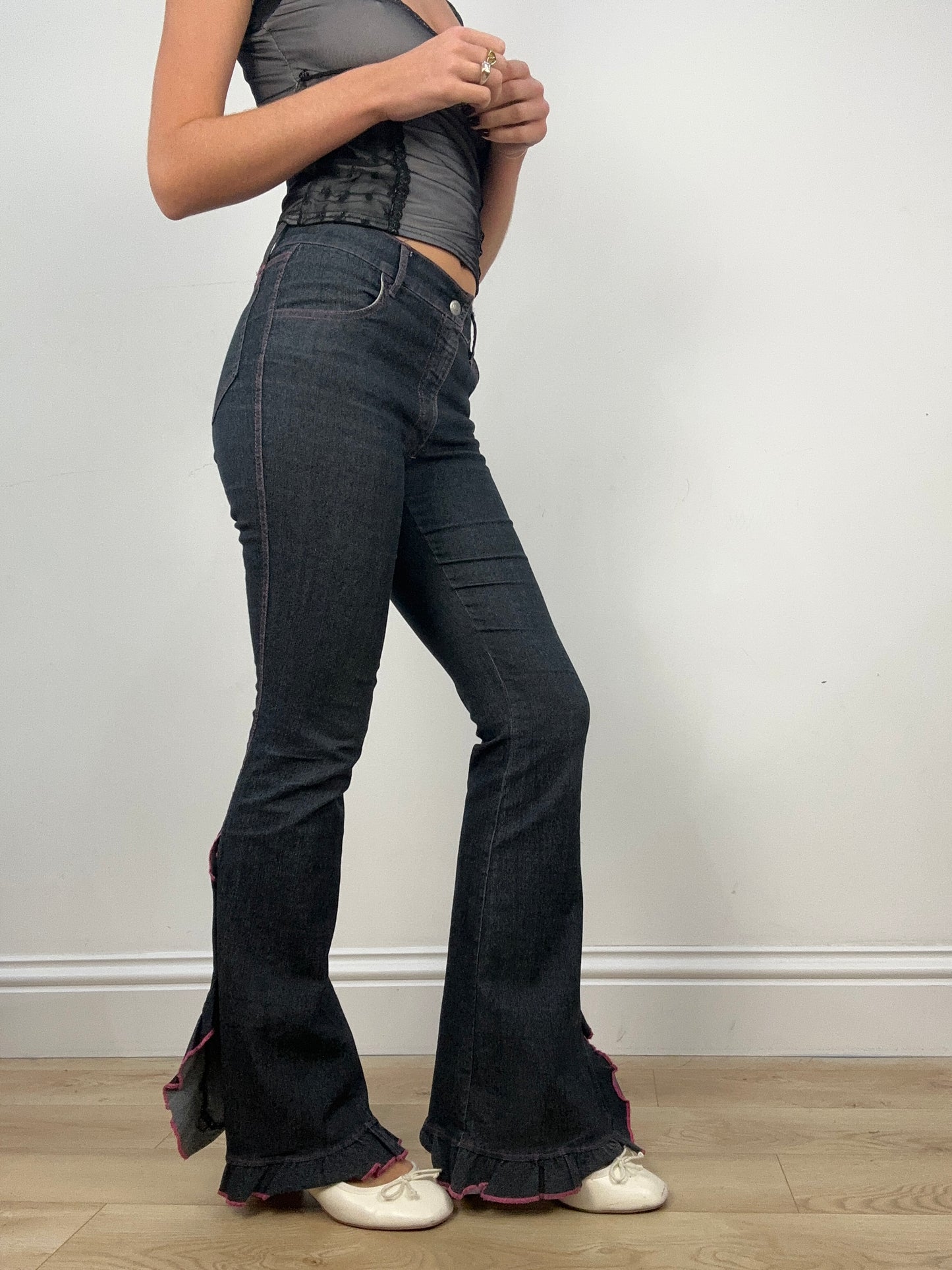 DATE NIGHT | medium dark wash flared jeans with pink stitching