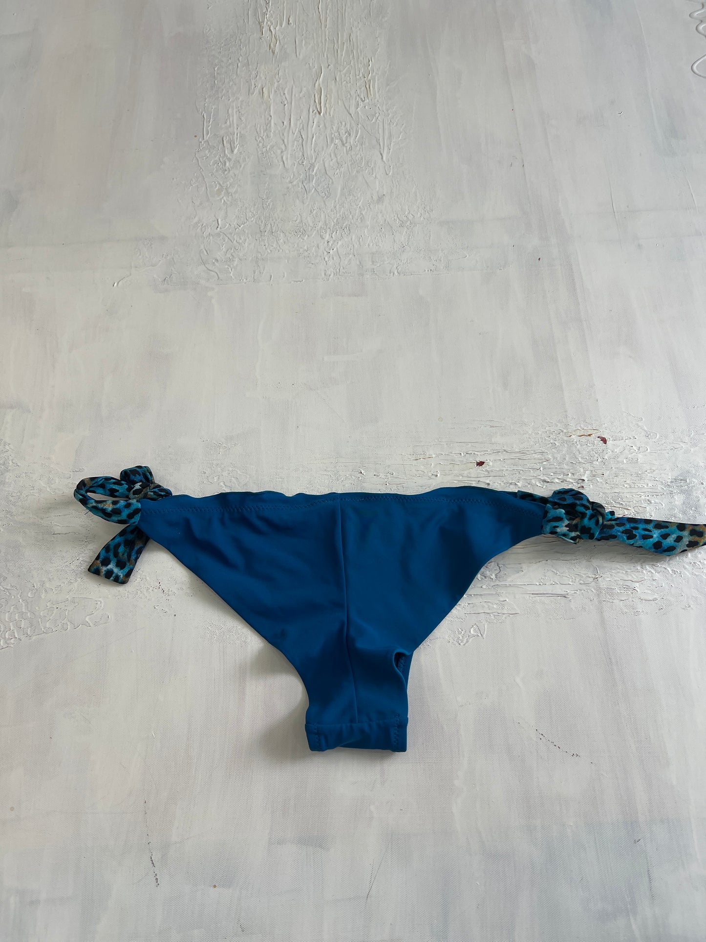 BRITISH SUMMER GIRL DROP | medium blue bikini bottoms with leopard print ties