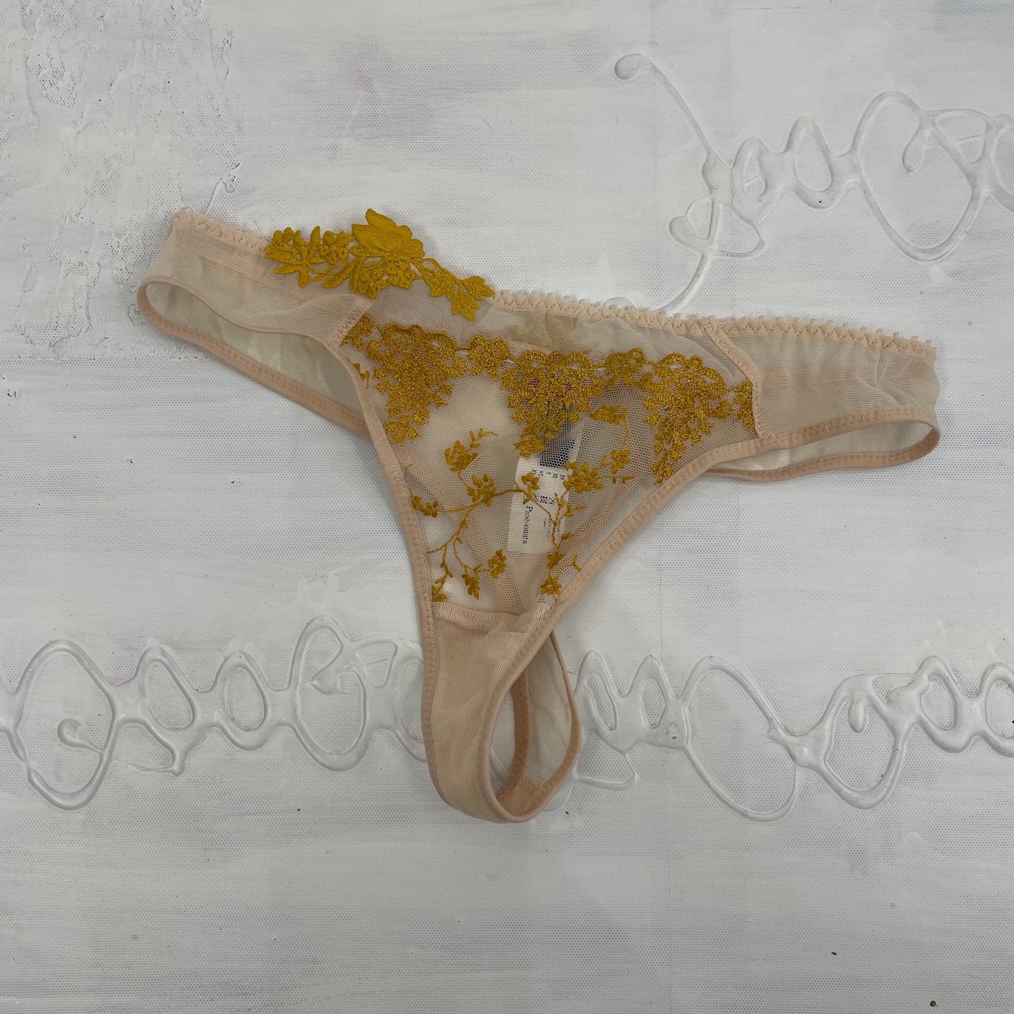 CHALET GIRL DROP | xs beige thong with gold embroidery