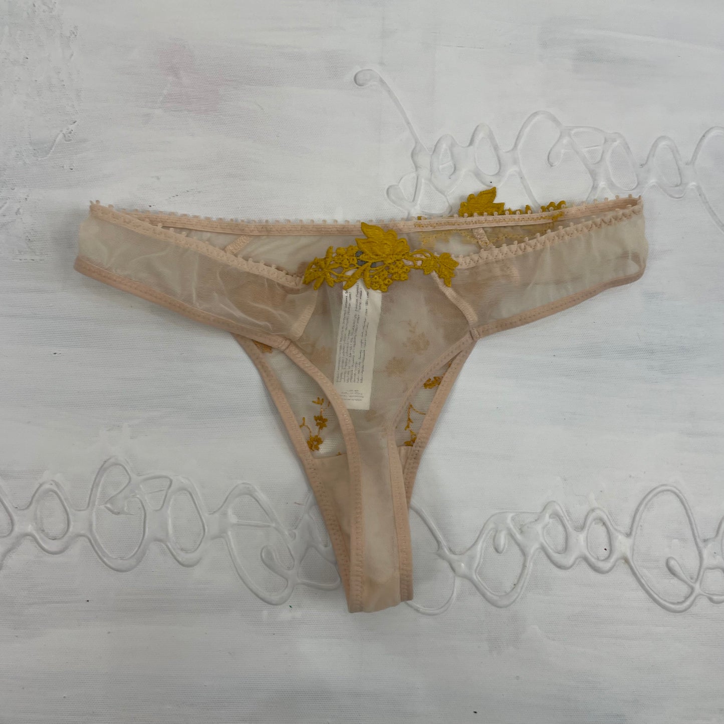 CHALET GIRL DROP | xs beige thong with gold embroidery